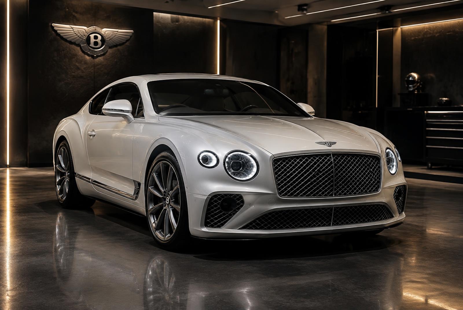 Pearl white Bentley Continental GT coupe in the Manasat Alibdaa Auto workshop in Sharjah